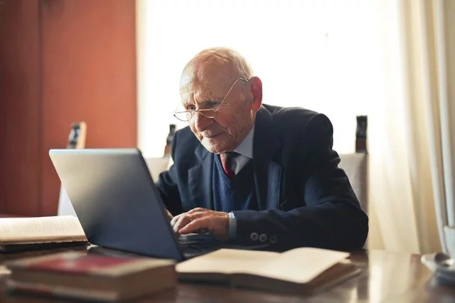 senior citizen getting safely logged in to the internet