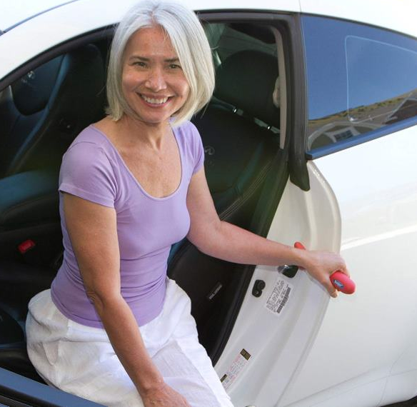 lady using a car door handle